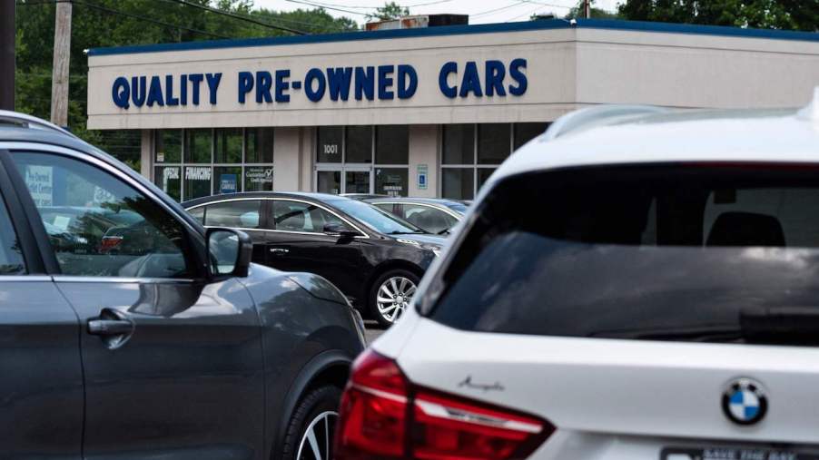 A close up of used cars for sale on a lot.