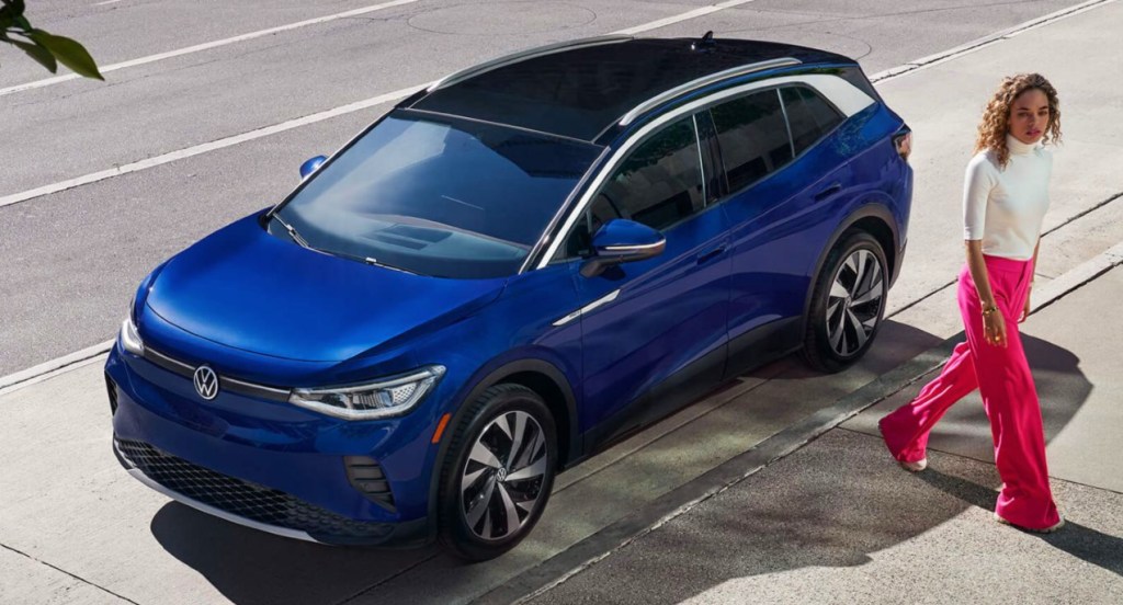 A blue 2022 Volkswagen ID.4 electric SUV is parked.