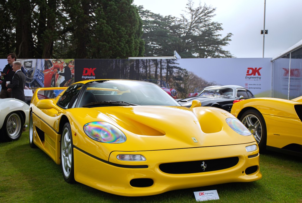 Yellow Ferrari F50 on the lawn of the Salon Prive Concours d'Elegance