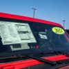2021 Jeep Gladiator sticker price and MSRP on a car dealership lot in Lansing, Kansas