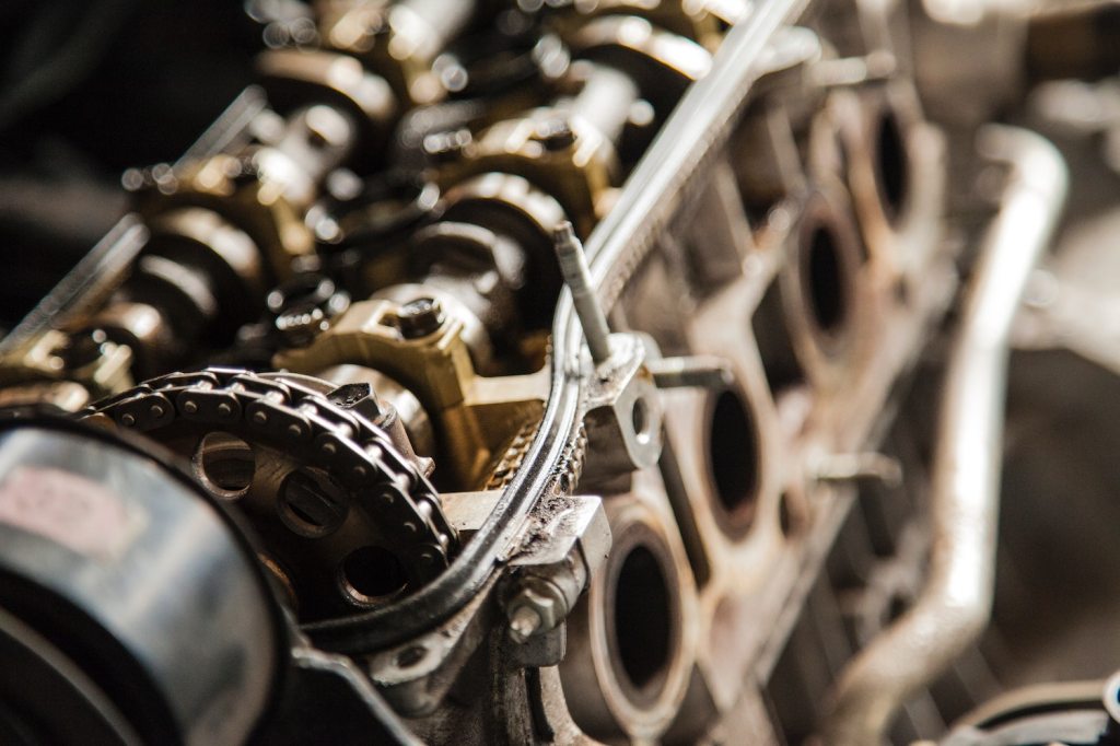 Detail shot of the exposed valvetrain of a disassembled internal combustion engine.