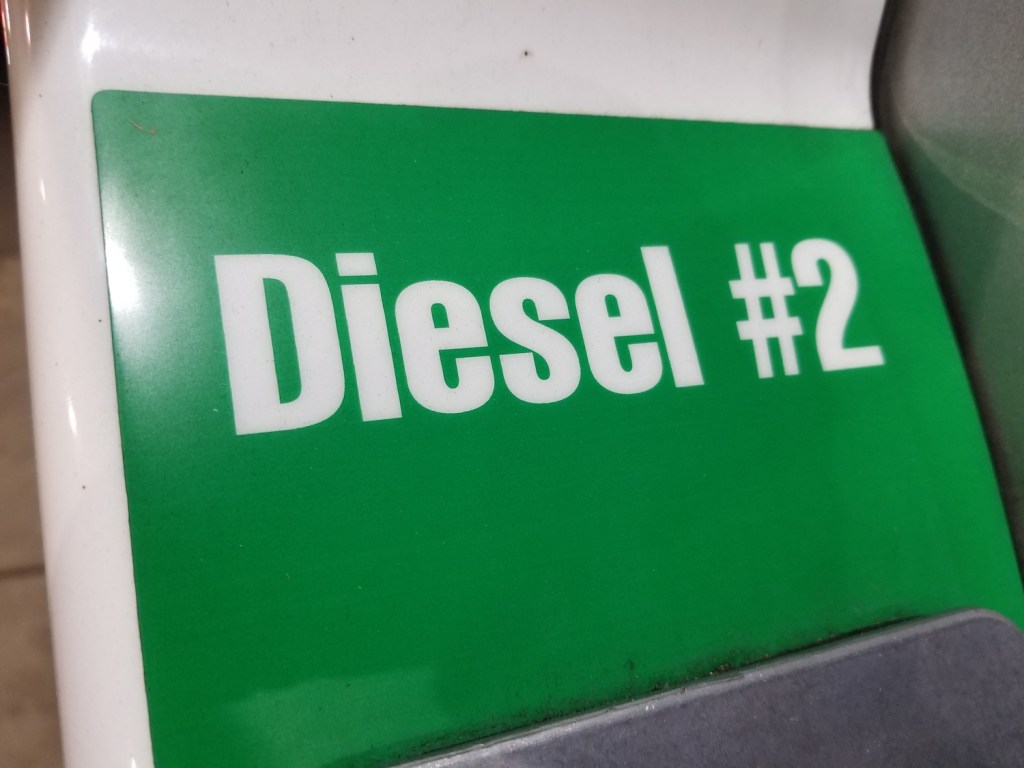 Close-up of text on green background reading Diesel