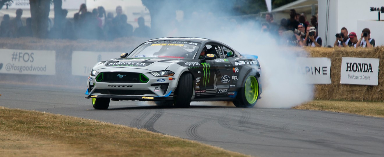 Vaugn Gittin Jr drifting a mustang around a track