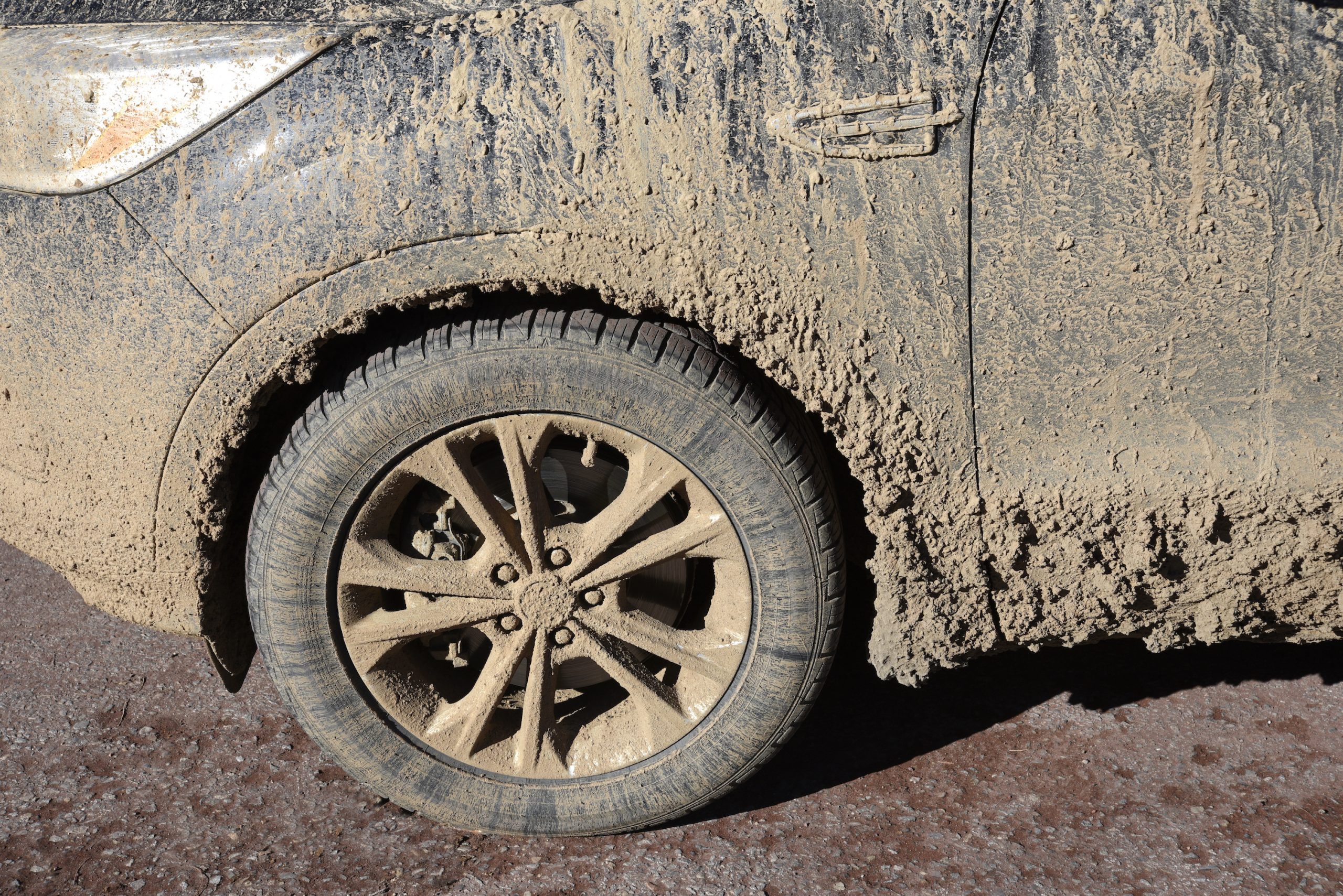A car with caked on mud and dirt