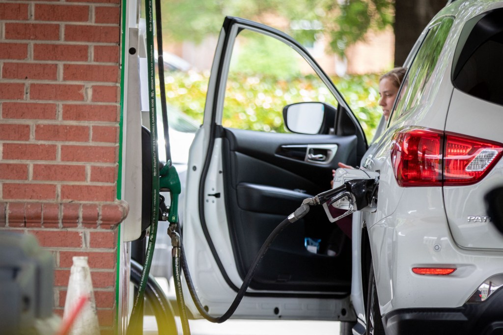 A lucky motorist manages to fill his gas tank at a Circle K.