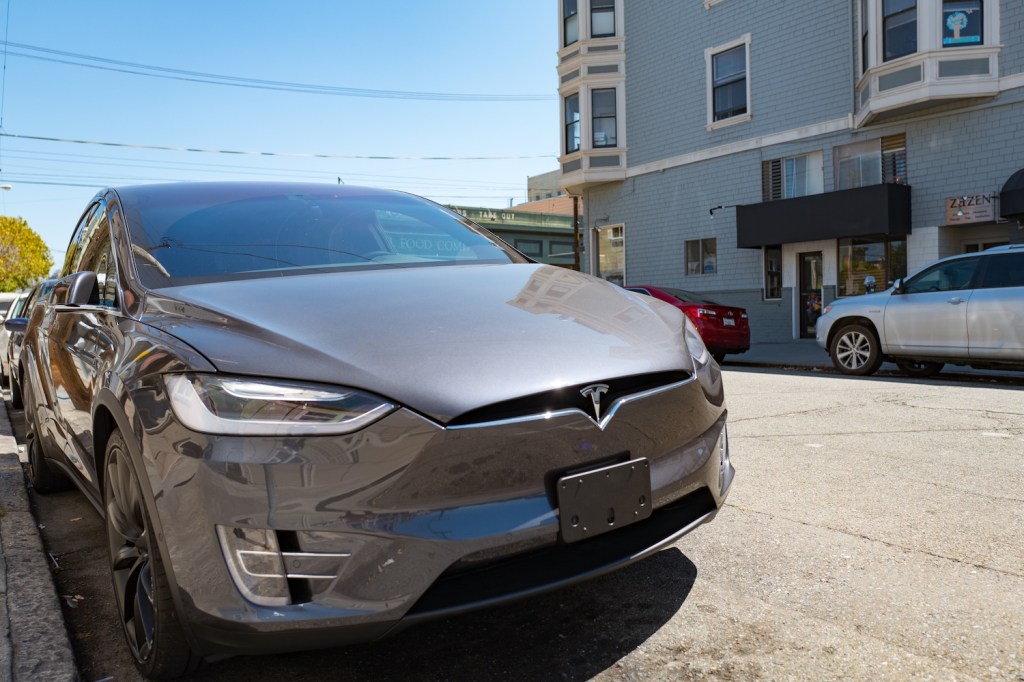 Tesla Model X parked on the side of the street