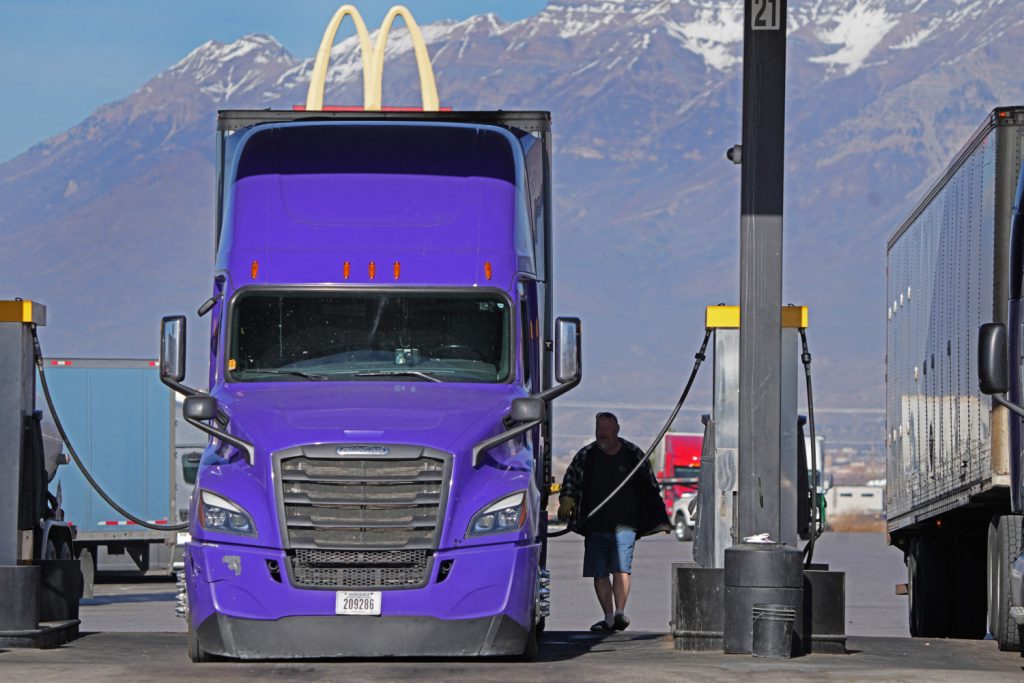 Long-haul truck driver fueling up, Should you turn off your car while pumping gas?