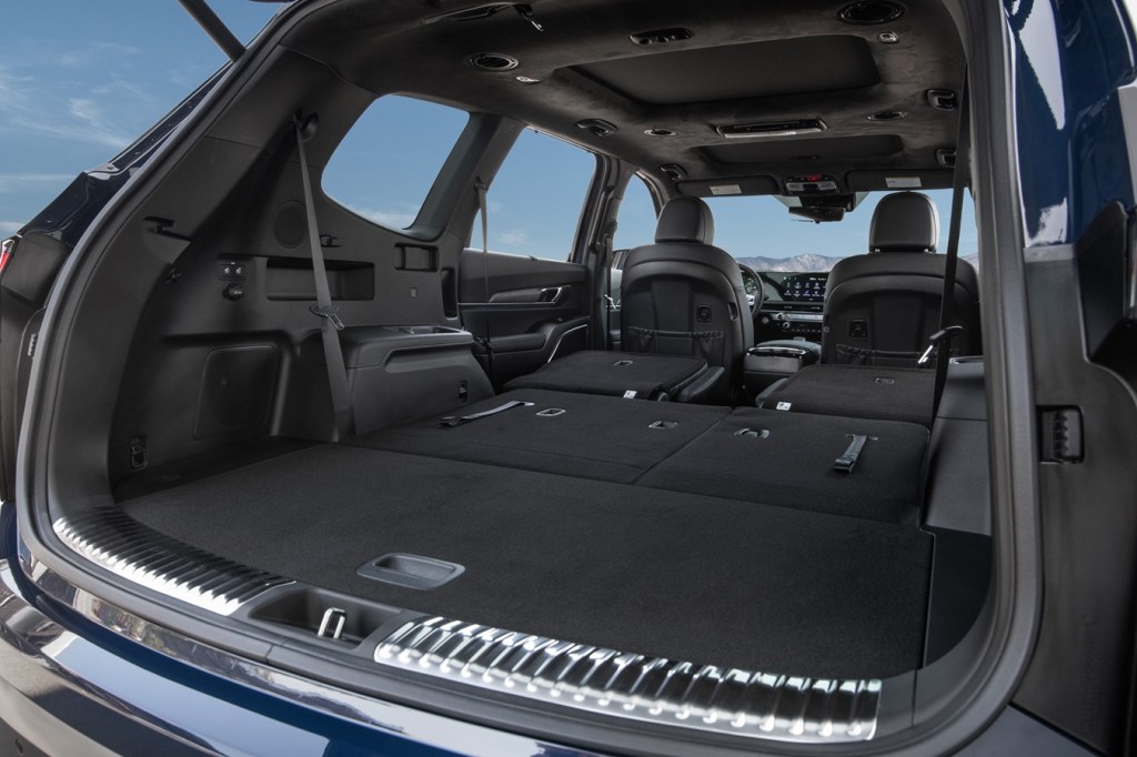 2023 Kia Telluride interior cargo area with rear seats down. New technology, features, cargo space.