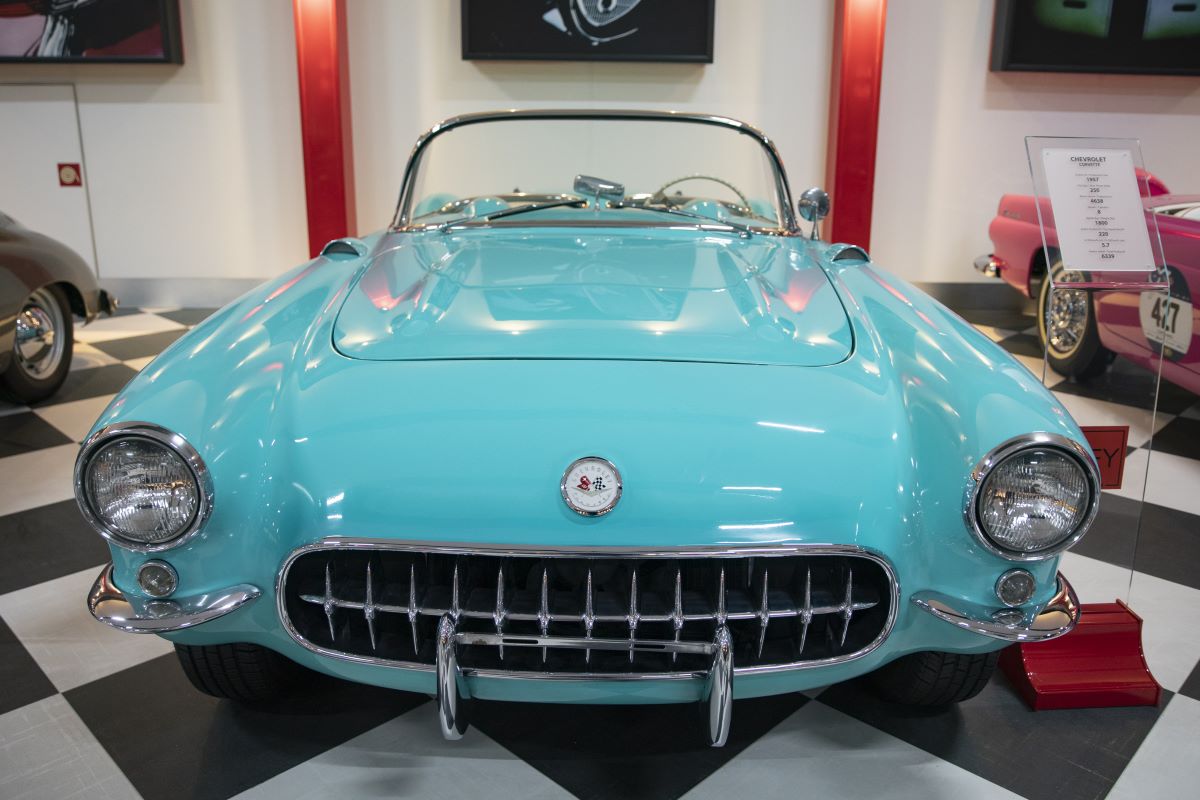 Turquoise 1957 Chevrolet Corvette sports car in a museum