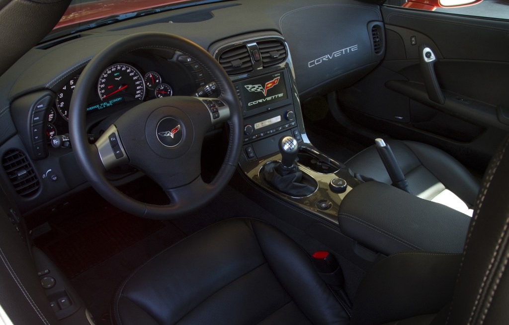 The black seats and dashboard of a 2011 Chevrolet C6 Corvette Z06