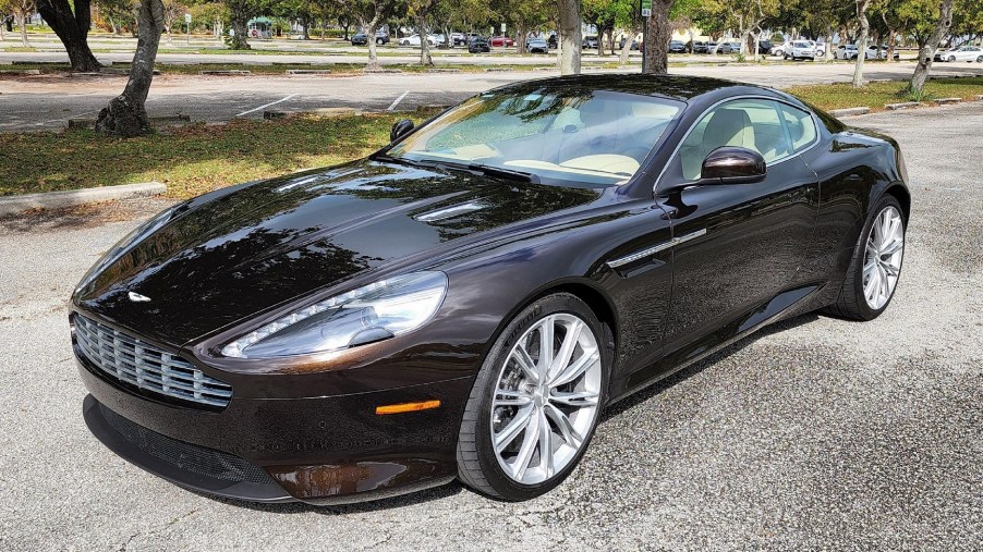 A brown 2012 Aston Martin Virage in a Florida park parking lot