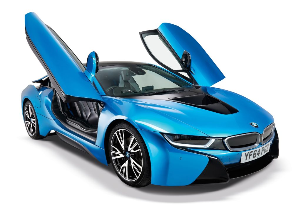 A blue 2015 BMW i8 with its gullwing doors up