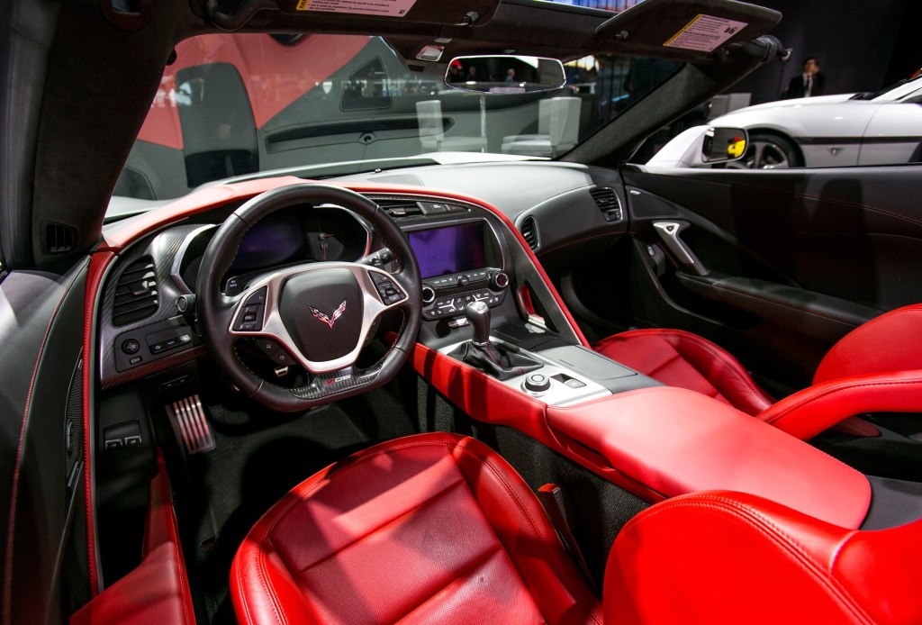 The red-leather seats and black dashboard of a 2015 Chevrolet C7 Corvette Z06 at NAIAS 2015