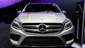 A gray Mercedes-Benz GLE luxury small SUV is parked.