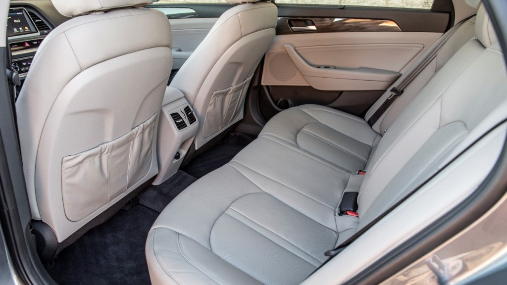 the spacious and comfortable rear seat of a 2018 hyundai sonata with soft leather seating