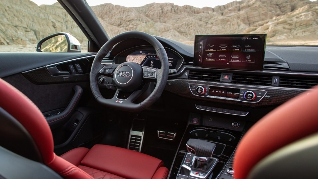 The interior of a 2020 Audi S4 is shown off with the red leather seating optioned.