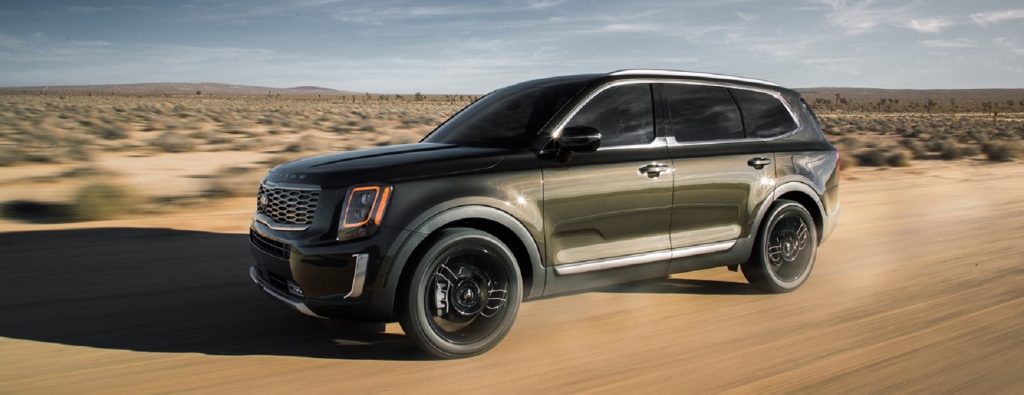 A taupe 2020 Kia Telluride parked in the desert. 