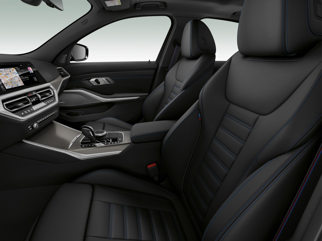 The black sport seats and dashboard in a 2022 BMW M340i xDrive