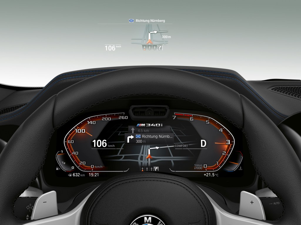 The digital gauge cluster and heads-up display in a European 2022 BMW 3 Series M340i xDrive