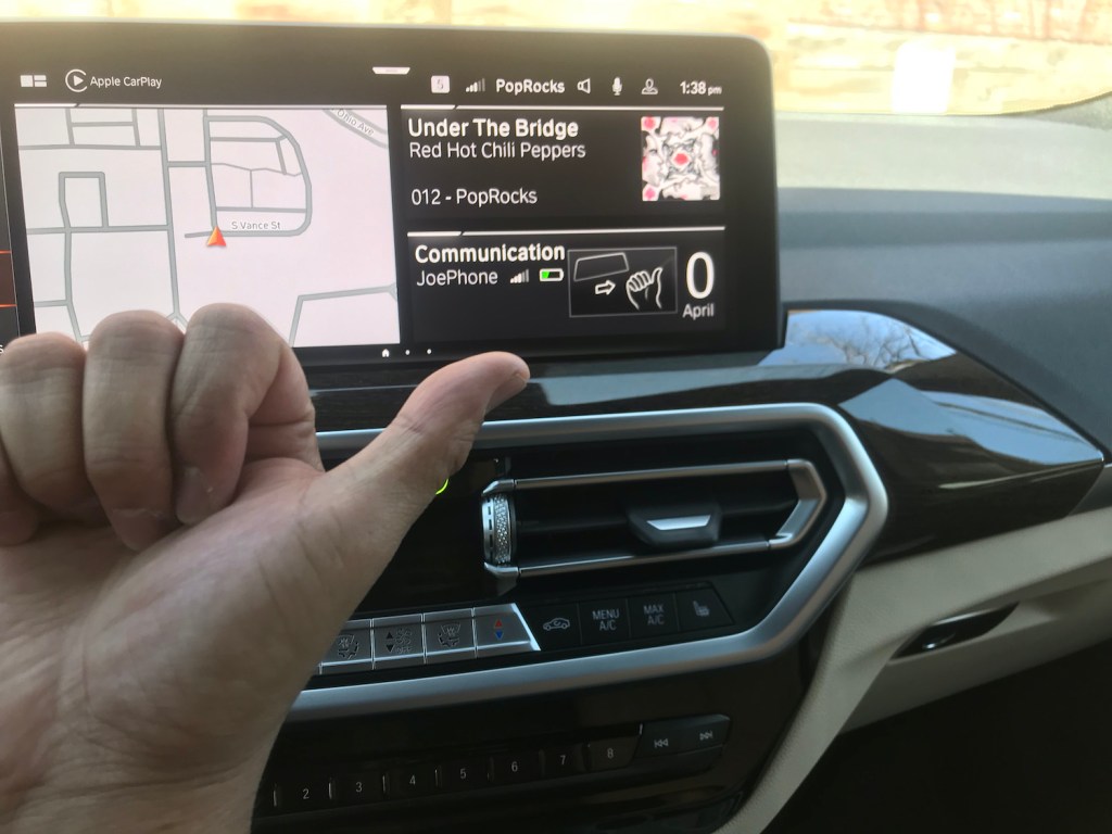 2022 BMW X3 gesture control thumb pointing to right