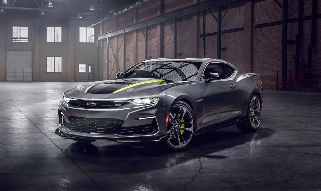 A gray-and-yellow 2022 Chevrolet Camaro Shock and Steel Special Edition in a warehouse