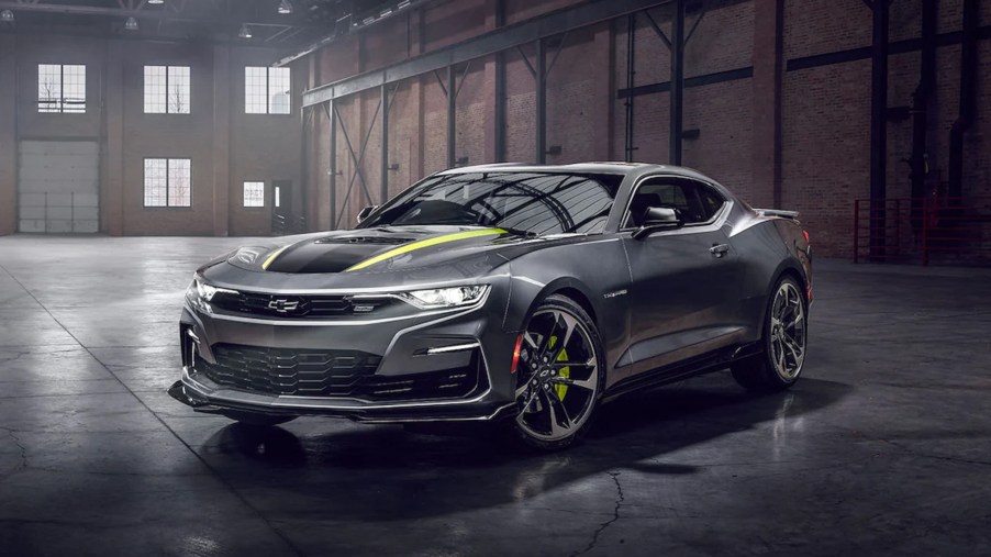 A gray-and-yellow 2022 Chevrolet Camaro Shock and Steel Special Edition in a warehouse