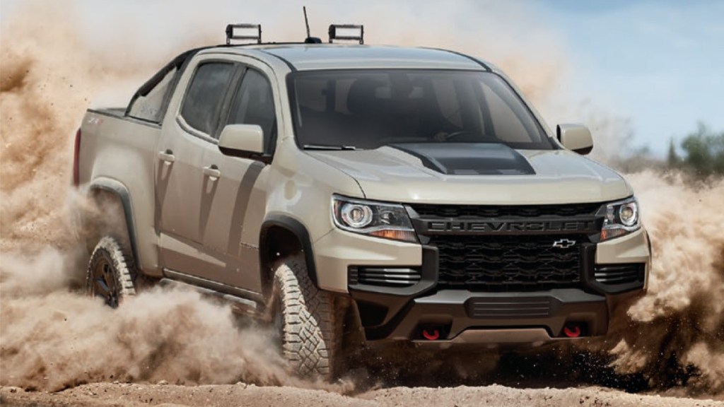 2022 Chevy Colorado playing in the dirt. This Chevy truck uses a diesel engine.