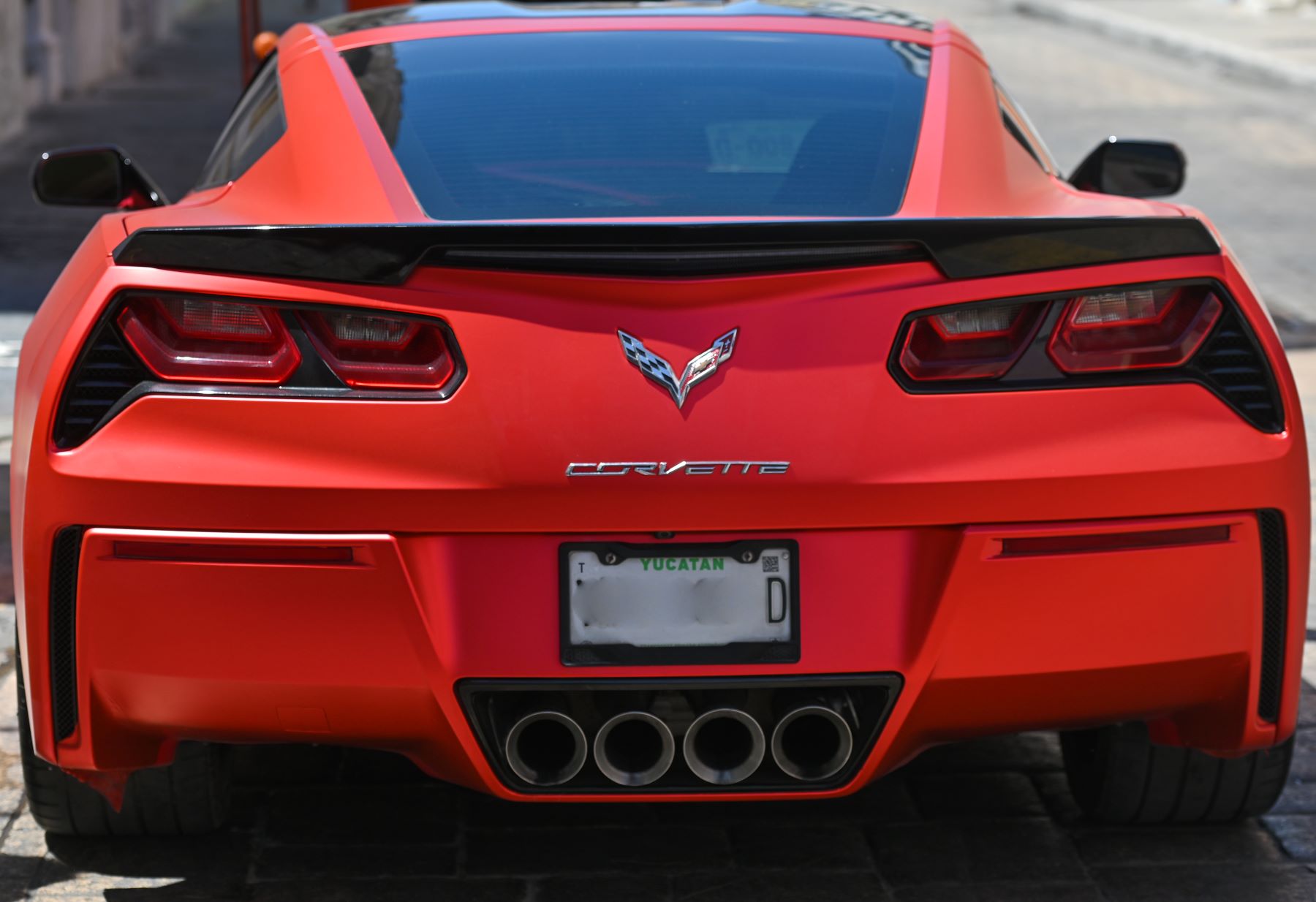 2022 Chevy Corvette luxury sports car rear end view of trunk taillights, and exhaust seen in Campeche, Mexico