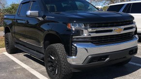 Black 2022 Chevy Silverado 1500 pickup truck in a parking lot
