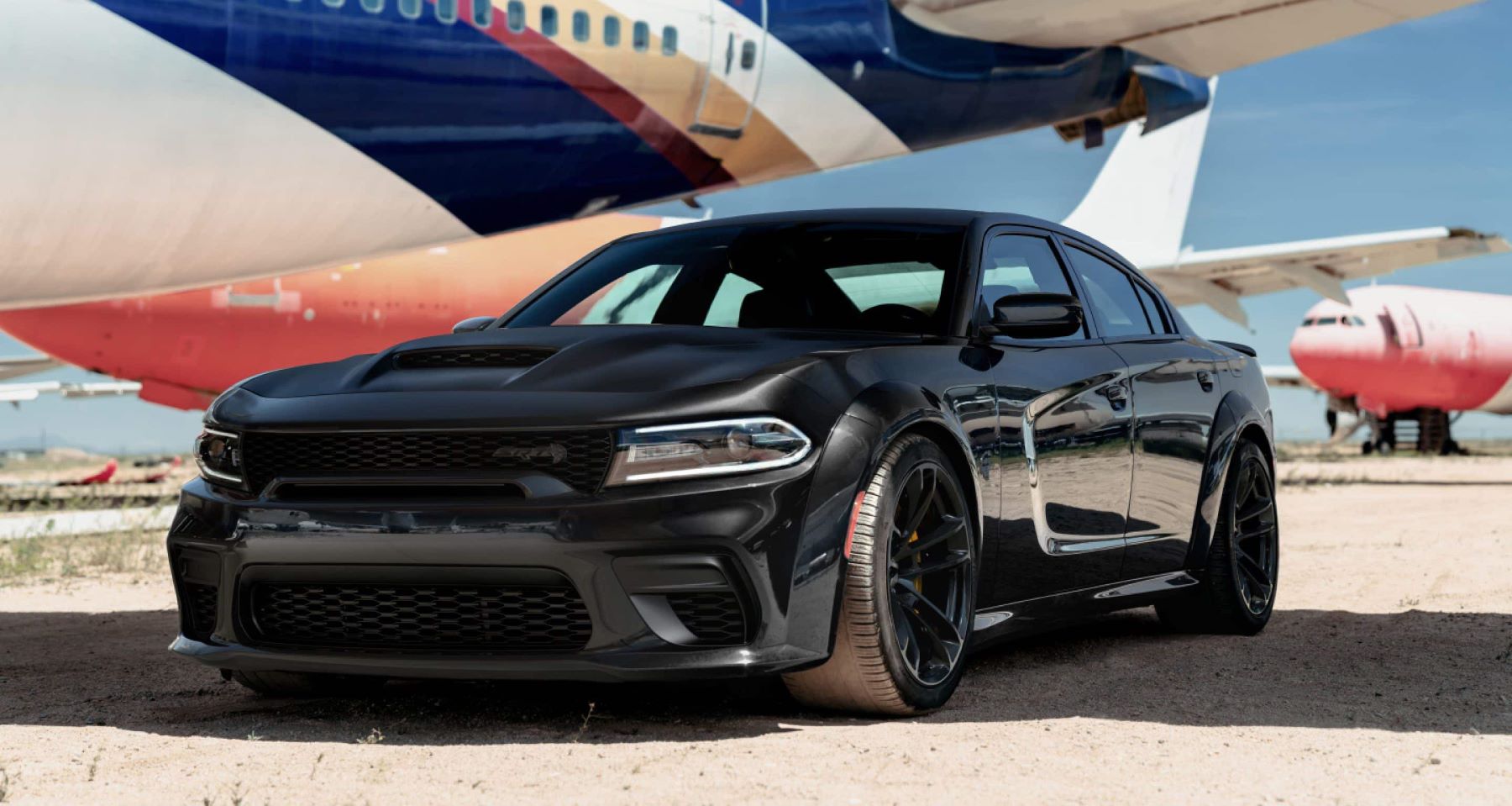 2022 Dodge Charger Jailbreak parked at a landing bay at an airport