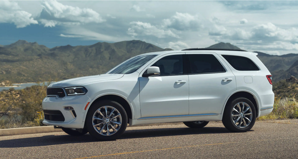 The 2022 Dodge Durango full-size performance SUV in white parked on the side of a rural highway