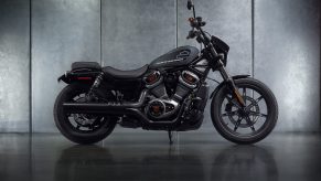 The side view of a gray-and-black 2022 Harley-Davidson Nightster in a gray studio