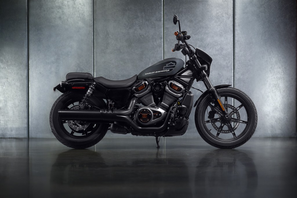 The side view of a gray-and-black 2022 Harley-Davidson Nightster in a gray studio