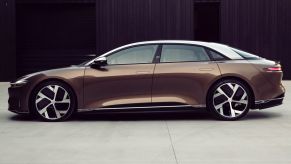 2022 Lucid Air Dream Edition electric vehicle (EV) side shot with a bronze body and white roof