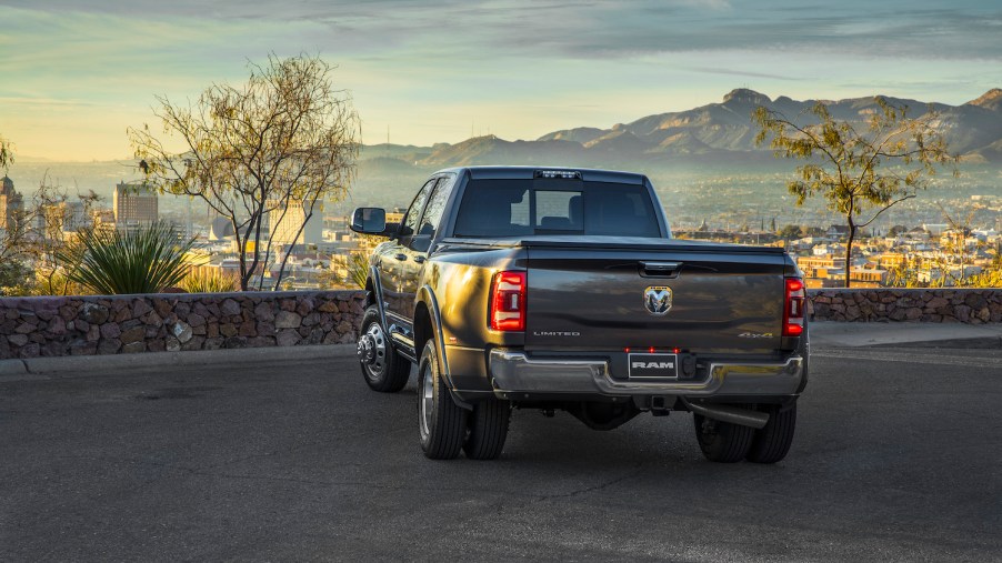 Promo photo of a Ram 3500 pickup truck in a parking lot, a city skyline bellow.