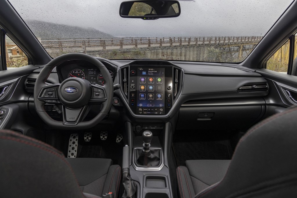 The black front sport seats and dashboard of a 2022 Subaru WRX
