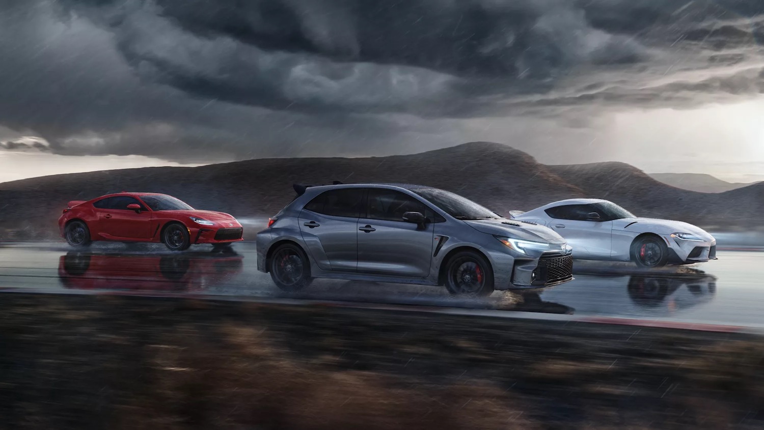 Toyota Gazoo Racing advertisment is the GR86, GR Corolla, and Supra racing down a track together.