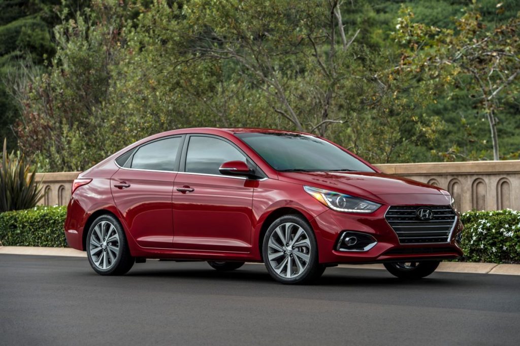 Side angle view of a red 2022 Hyundai Accent, one of the best new cars under $20,000