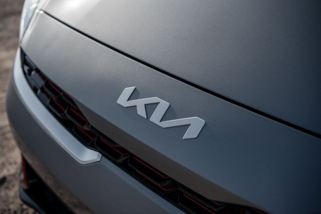 Close up view of the redesigned Kia brand logo on the front end of the 2022 Kia Forte FE base model