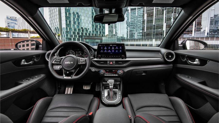 Black cloth interior of the Kia Forte's best trim level, the GT Manual with a manual transmission and premium features