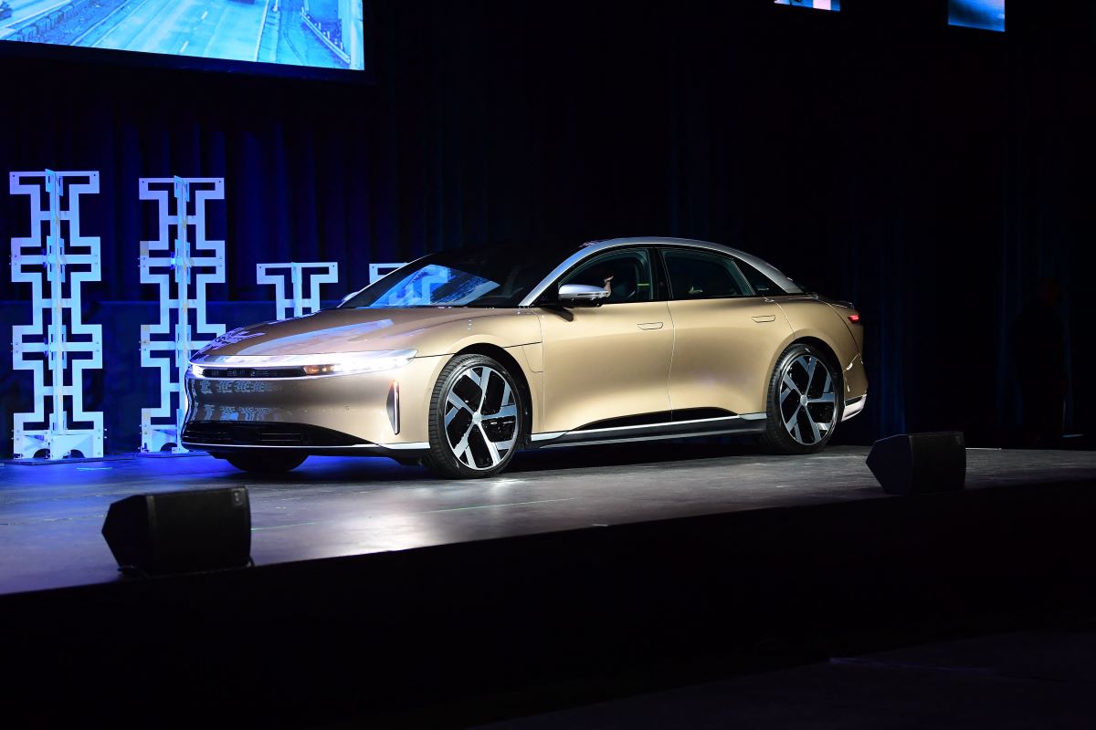 The 2022 Lucid Air, the best electric car in 2022, parked in gold on a podium