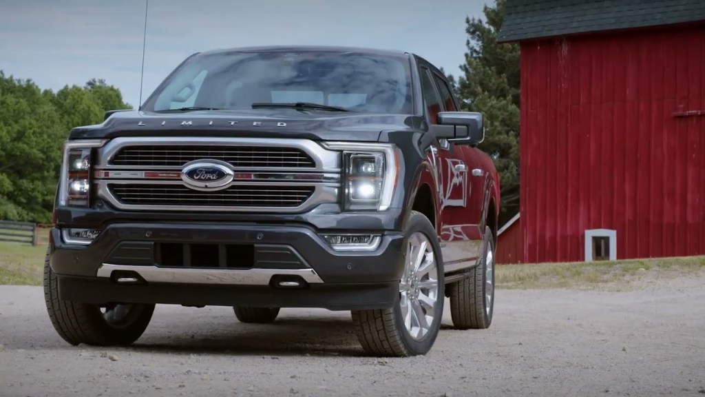 The 2023 Ford F-150 parked near a barn