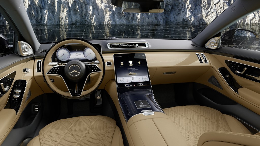 The gold Nappa leather front seats and black-and-gold dashboard of a 2023 Mercedes-Maybach S 680 by Virgil Abloh