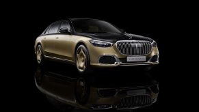The black-and-gold 2023 Mercedes-Maybach S 680 by Virgil Abloh against a black background