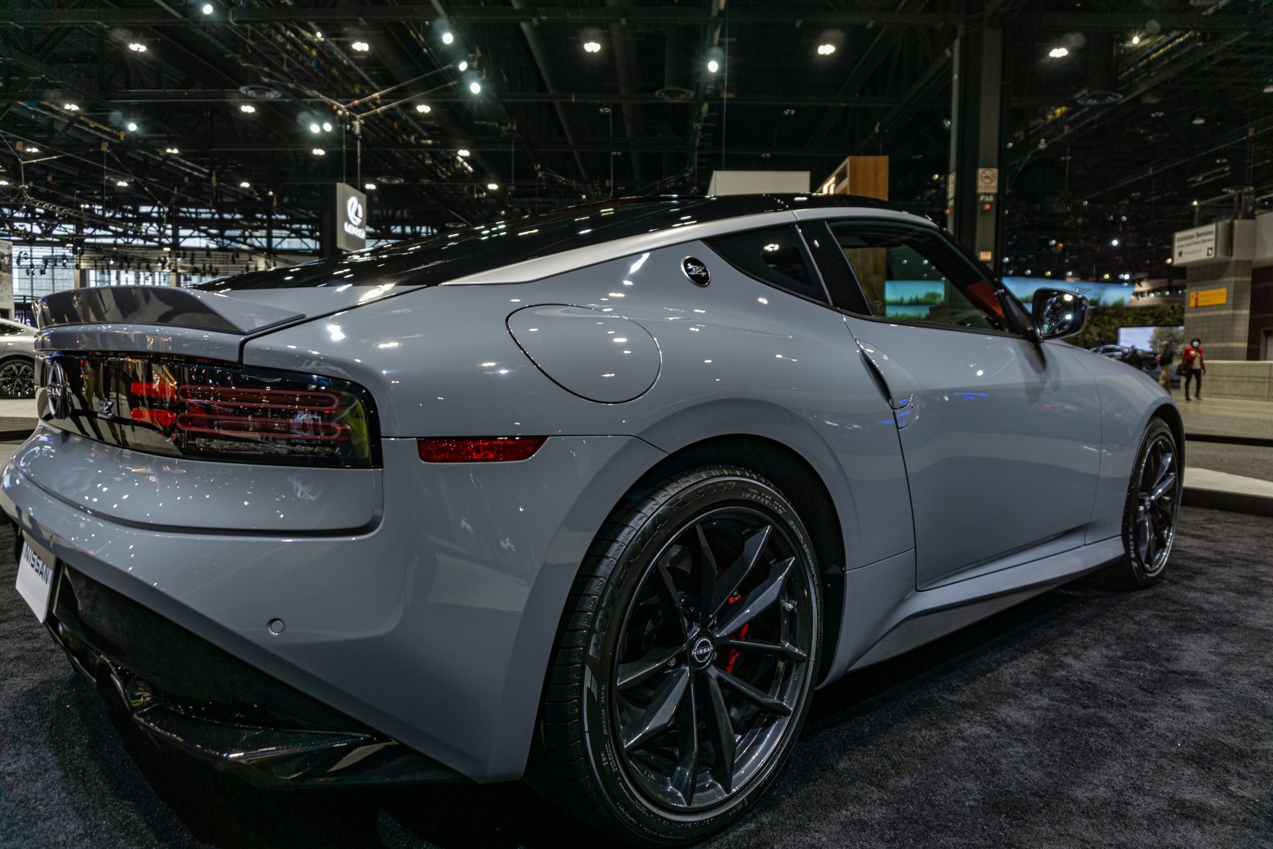 The rear 3/4 view of a gray 2023 Nissan Z Performance at the 2022 Chicago Auto Show
