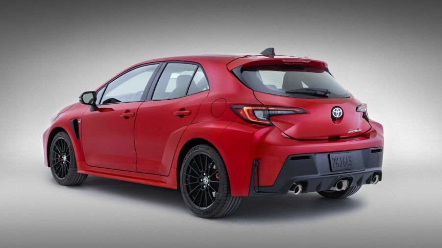 The rear 3/4 view of a red 2023 Toyota GR Corolla Core