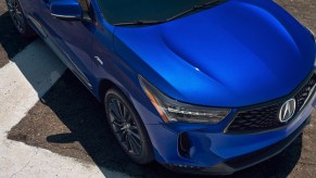 A blue 2022 Acura RDX small SUV is parked.
