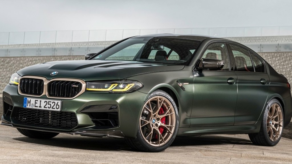 a dark green 2022 bmw m5 competition parked showing its stylish design