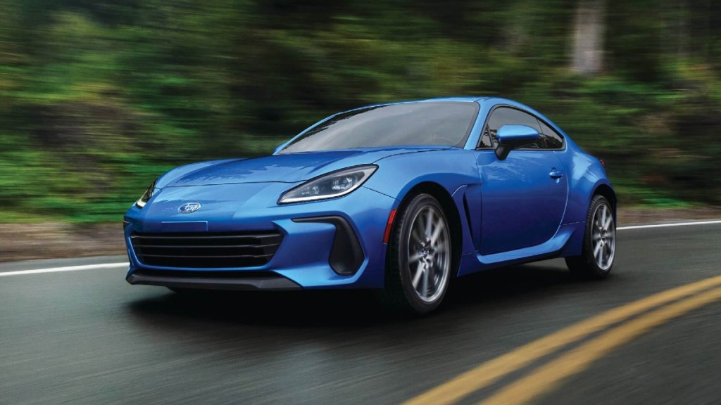 Blue 2022 Subaru BRZ, a fast car more reliable than a Toyota Prius, driving on a curvy road