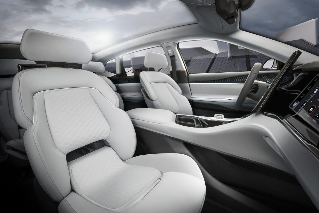 The white-leather seats and screen-covered dashboard of the CES 2022 Chrysler Airflow Concept